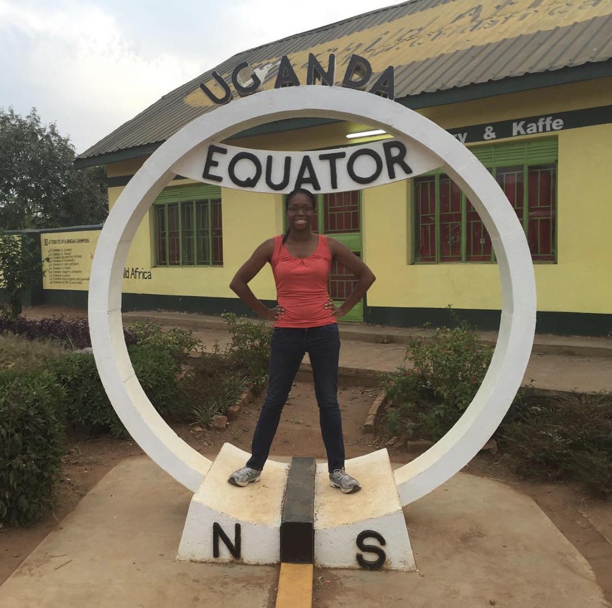Oye standing inside the Uganda Equator marker